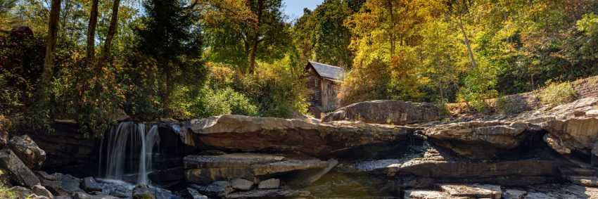 Cabin in woods on river edge